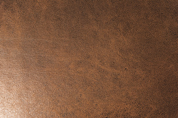Textured background surface of textile upholstery furniture close-up. leatherette brown color fabric structure