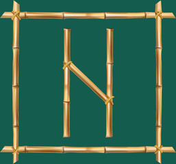 Capital letter N made of realistic brown dry bamboo poles inside of wooden stick frame
