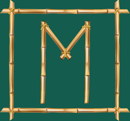 Capital letter M made of realistic brown dry bamboo poles inside of wooden stick frame