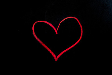 red heart, hand drawn on a black chalkboard for valentine.