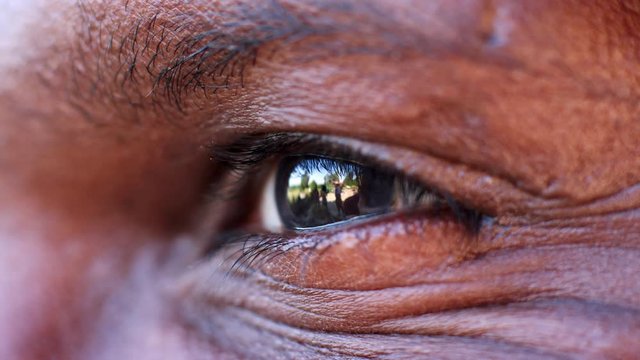 Close up detail of the eye of a middle aged black man