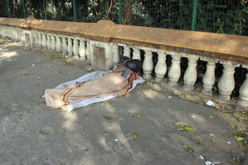 Homeless people sleeping on the footpath of Kolkata