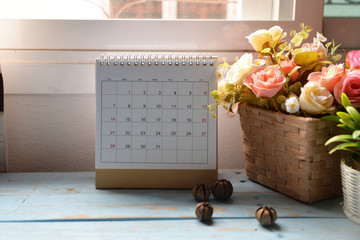 Desktop Calendar 2019 and clock place on wooden office desk.Calender for Planner timetable,agenda appointment,organization,management on table.Calendar Background Concept.
