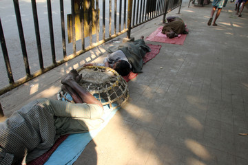 Homeless people sleeping on the footpath of Kolkata