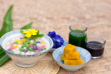 Obraz na płótnie Canvas Thailand Bua Loi,Thai sweetmeat with colorful ball flour, coconut, Tapioca, rainbow, popular and famous thailand dessert .