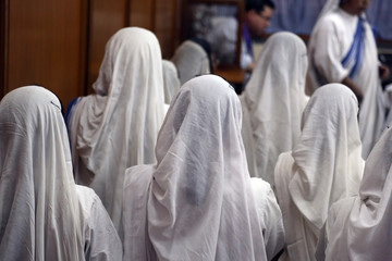 Sisters of Mother Teresa's Missionaries of Charity in prayer in the chapel of the Mother House,...