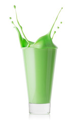 Glass of green smoothie or yogurt with splash
