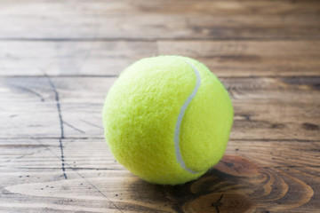 Tennis Ball on Wood Background, Sport Concept and Idea, Rustic Style. - obrazy, fototapety, plakaty