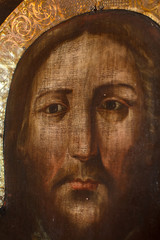 an old icon painted on black bred covered with gold