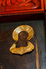an old icon painted on black bred covered with gold