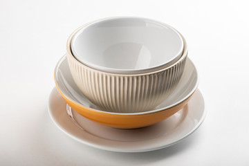 Pile of tableware on white