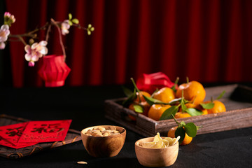 Concept image of the lunar new year - mandarin orange, jam and red packet
