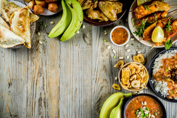 West african food concept. Traditional Wset African dishes assortment - peanut soup, jollof rice,...