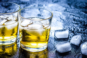glass of whiskey on dark background