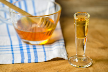 homemade mead (honey wine) on an old table close up
