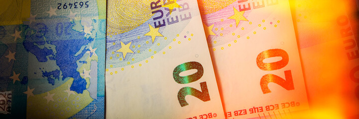 Euro paper notes are on the table. Web banner.