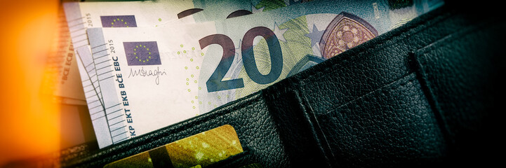 Euro paper notes are on the table. Web banner.