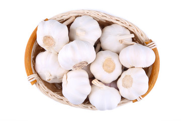 Isolated garlic. Fresh garlic in basket on white background