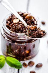 Spa concept with natural coffee scrub on wooden table background