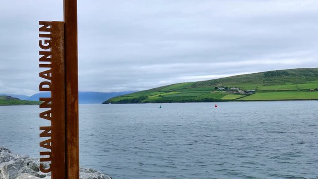 'CUAN AN DAINGIN' vertical gaeilge Dingle town sign overlooking Dingle Bay.