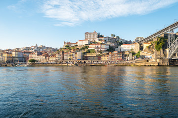 Fototapeta na wymiar View to Porto with the Episcopal Palace and the Ribeira Pier from Vila Nova de Gaia