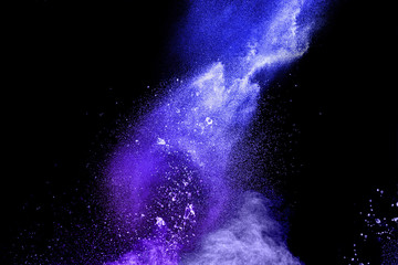 blue powder explode cloud on black background. Launchedblue dust particles splash on  background.