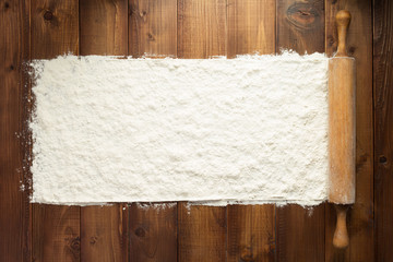 wheat flour on wooden background