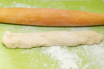 The raw dough is prepared for the preparation of homemade dumplings
