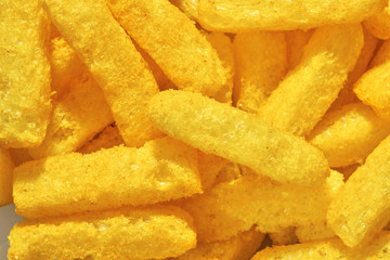 Cheese puffs, Colorful Cheetos. Close up shot of Cheese puffs, background texture