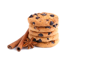 Chocolate cookies with cinnamon sticks and star anise isolated on white background.
