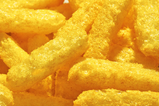 Cheese Puffs, Colorful Cheetos. Close Up Shot Of Cheese Puffs, Background Texture