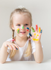 Caucasian Little Girl Painting with Colorful Hands Paints at Home Early Education Preparing for...