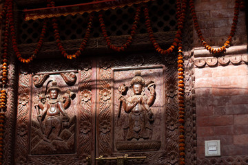 old carved wooden door at temple