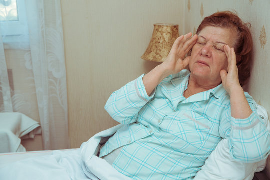 Elderly Woman Feeling Sick In Bed