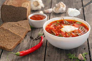 photo for menu, Russian borscht with sour cream garlic pepper and sauce, Ukrainian borscht with sour cream