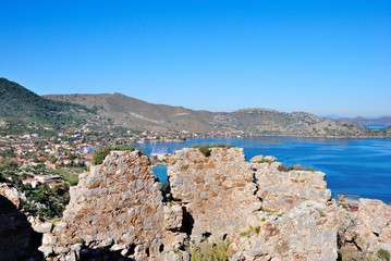 Fototapeta na wymiar View of Selimiye village and bay from the ruins of an ancient Hydas castle on the Sarıkaya Hill Marmaris resort town in Mugla Province of Turkey