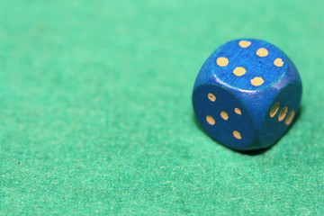 Dice on green background.