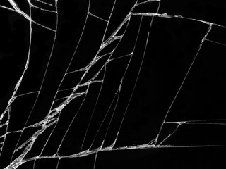 Cracked glass texture on black background. Isolated realistic cracked glass effect.