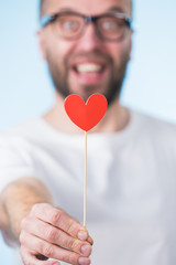 Adult man with heart on stick