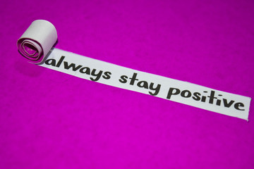 Always stay positive text, Inspiration, Motivation and business concept on purple torn paper