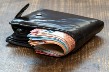 Wallet full of euro cash