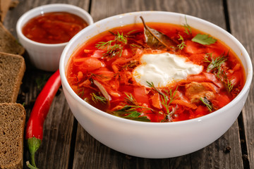 photo for menu, Russian borscht with sour cream garlic pepper and sauce