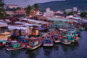 Phu Quoc island in Vietnam at sunset. Fishing boats in Duong Dong city
