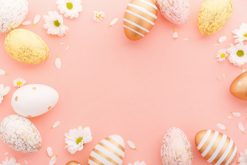 Easter Flat Lay of Eggs with flowers on pink