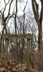 The old wood leaving fort sign on a close up view.