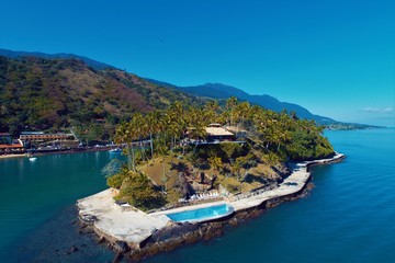 Naklejka premium Aerial view of Cabra's Island with blue sea. Fantastic landscape. Great beach view. Ilhabela, Brazil