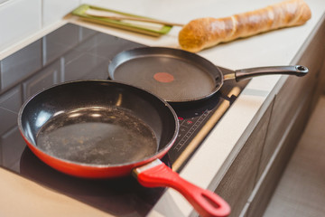 Closeup of housewife preparing snack - tapas and sandwiches - home cooking - step 3 heat up the pan on the stove