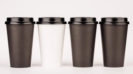 black paper cups on white background.