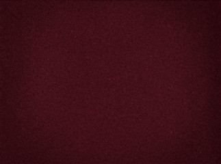 Texture of cardboard closeup, dark red abstract paper background.