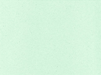 Texture of cardboard closeup, light green abstract paper background.